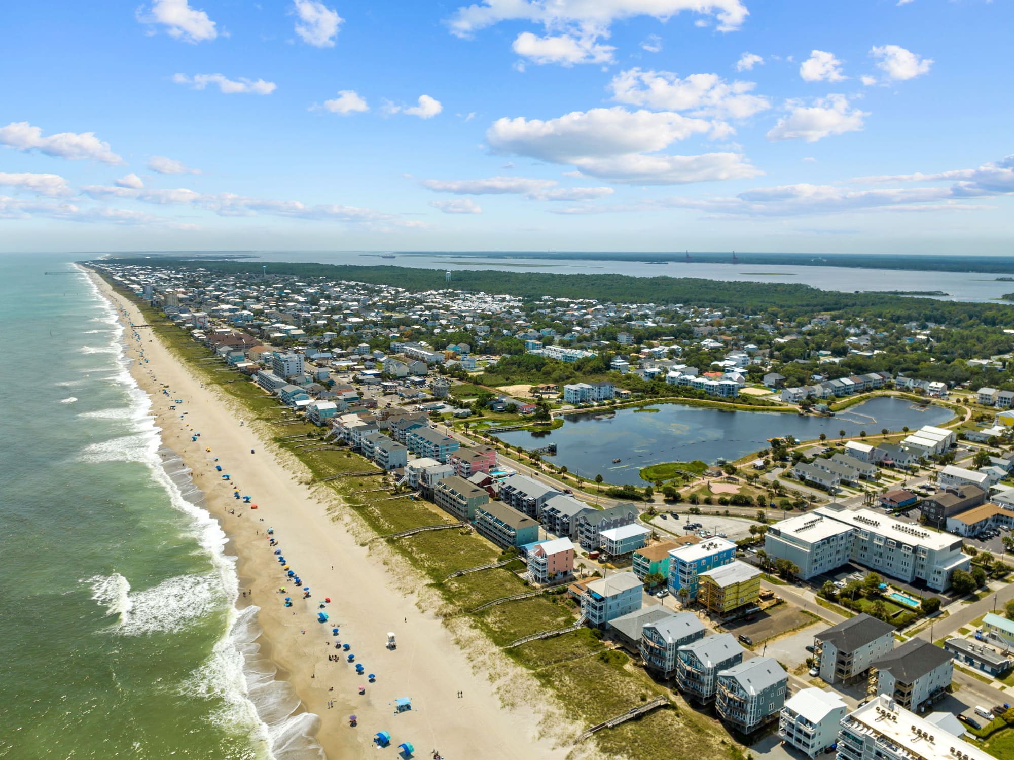 Aerial view of the Carolina Beach shoreline, oceanfront homes and the lake